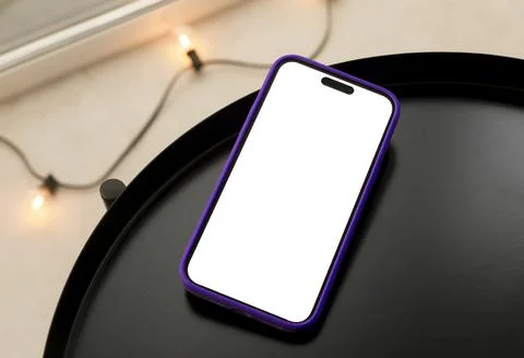 Blank white smartphone screen mockup standing on a round table with string Stock Photos
