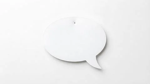 Blank white speech bubble cutout on a clean white background for text copy .. Stock Photos
