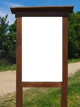 Blank white vertical rectangular pylon stand on forest dirt road mock up. Empty Stock Photos