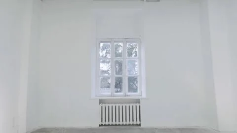 Blank white wall with window. Slide motion of movement or hitting the camera on Foto stock