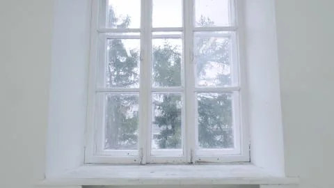 Blank white wall with window. Slide motion of movement or hitting the camera on Foto stock