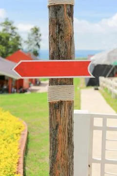 Blank wooden allow pointer red sign for background 스톡 사진