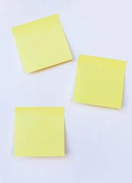 Blank yellow note on isolated white background Stock Photos