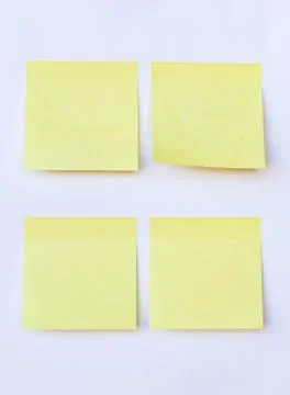Blank yellow note on isolated white background Stock Photos