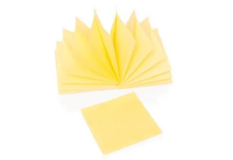 Blank yellow sticky note and block on white Stock Photos