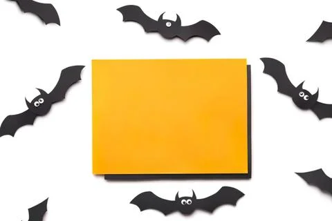 Blank yellow sticky note with flying cartoon bats background Stock Photos
