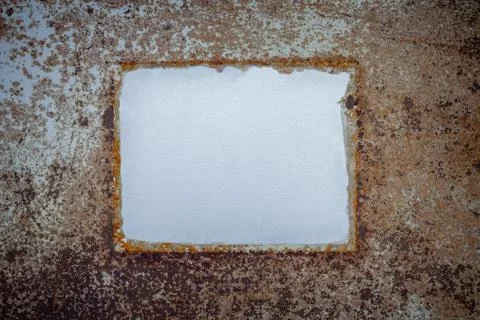 Blanked sheet placed on old sheet of iron covered with rust and corrosion pai Stock Photos