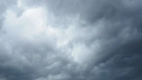 A blanket of dark clouds envelops the skyline, signaling an impending storm. The 스톡 동영상 297013495