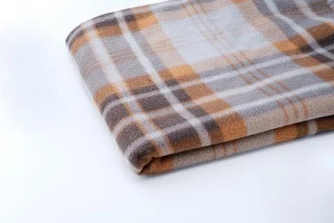 Blanket with a pattern isolated on gray. Stock Photos