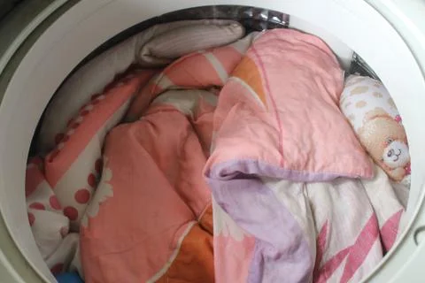 Blanket in washing machine. Stock Photos