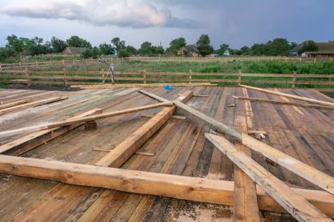 Blanks for the construction of a frame house on the background of a rural lan Stock Photos