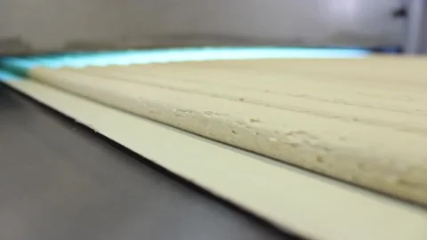 Blanks from the mixture for making sweet bars move along a conveyor belt Stock Footage 128643003