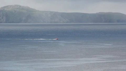 Blasket with boat speeding past Stock Footage 95321815