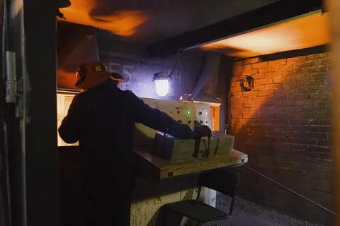 Blast furnace operator at control panel. Stock Photos