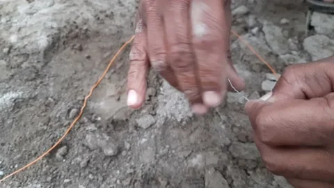 Blaster Specialist Connecting Dynamite Inside Rock. A laborer is Stock Footage 168234470