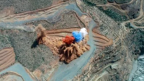 Blasting process in a mine for mineral extraction Stock Photos