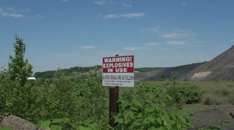 Blasting Sign at Strip Mine Stockbeeldmateriaal 64325209