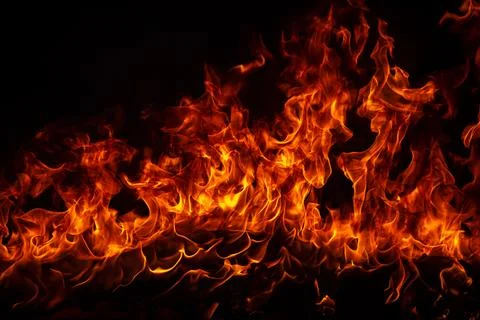 Blaze burning fire flame on art texture background. Stock Photos
