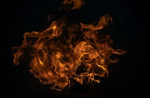 Blaze burning fire flame on art texture background. Stock Photos