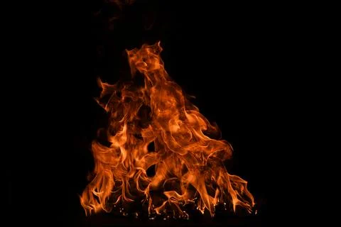 Blaze burning fire flame on art texture background. Stock Photos
