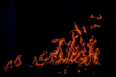 Blaze burning fire flame on art texture background. Stockfoto's