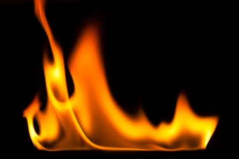 Blaze of fire isolated on black ground Stock Photos