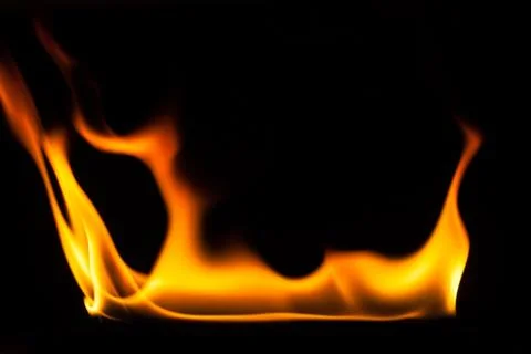Blaze of fire isolated on black ground Stock Photos