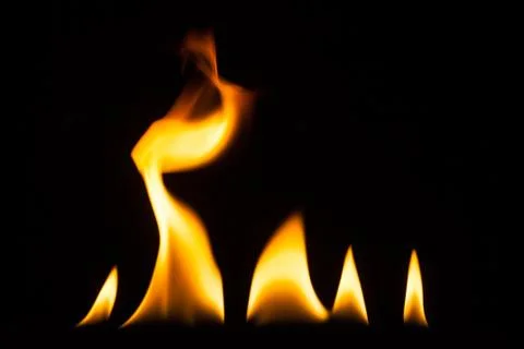Blaze of fire isolated on black ground Stock Photos