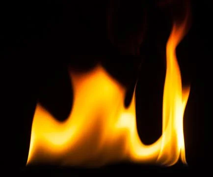 Blaze of fire isolated on black ground Stock Photos