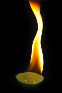 Blaze on a part of lime with black background Stock Photos