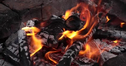 The blazing fire of the campfire. Hot coals of burning wood in the fireplace. Stock Footage 149783174