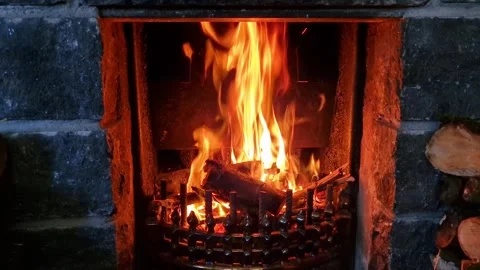 A blazing fire in a small fireplace, up close with some movement Stock Footage 325511739