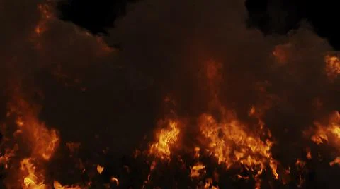 A blazing flame on a black background.Texture or background Stock Photos