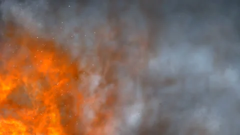 Blazing flames in the foreground against a background of smoke Stock Footage 145184689