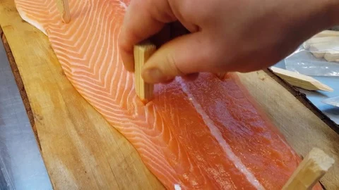 Blazing salmon, tapping glace salmon fillet on a wooden plate, at a restaur.. Stock Footage 74484348