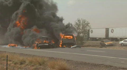 Blazing vehicles in highway car wreck Stock Footage