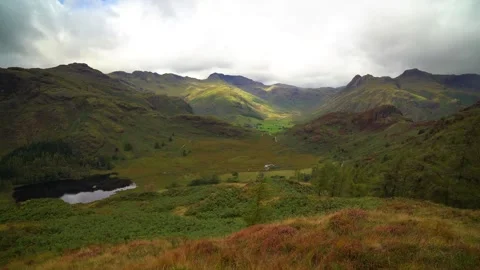 Blea tarn and sunlight on the band Stock Footage 346898944