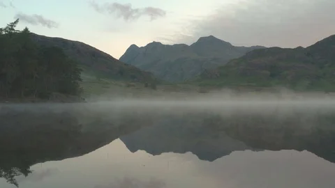 Blea Tarn in the Lake District during Sunrise Stock Footage 112609949