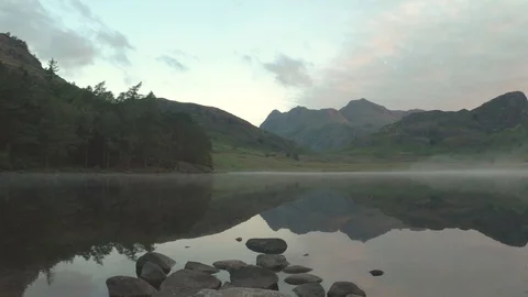 Blea Tarn in the Lake District during Sunrise Stock Footage 112609951