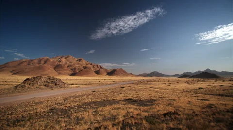 BLEACHED GRASSLAND MOUNTAIN BACKDROP HD Stock Footage 45342190