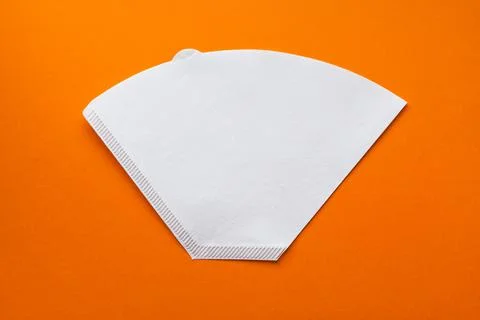 Bleached paper coffee filter for immersion brewing isolated on a colored pink Stock Photos