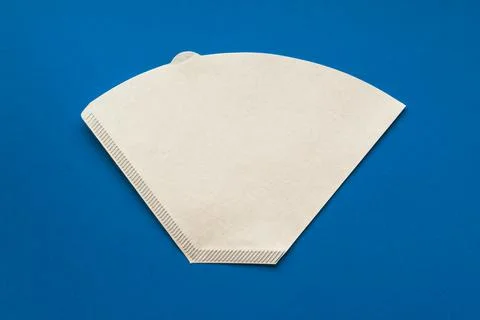 Bleached paper coffee filter for immersion brewing isolated on a colored pink Stock Photos