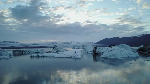 Bleak arctic landscape aerial flying over icebergs Video stock 166863653
