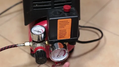 Bleeding of air from the receiver and automatic activation of the compressor Stock Footage 87042349