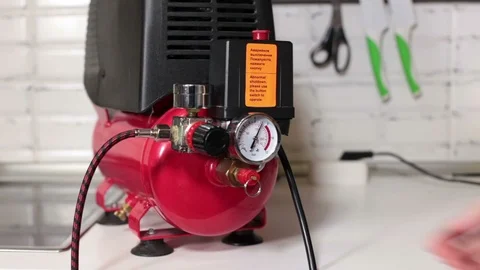 Bleeding compressed air from the receiver of the compressor, close up view Stock Footage 87042346