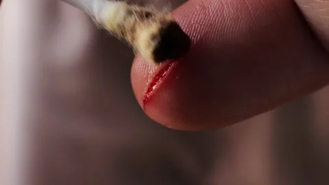 Bleeding finger from a knife cut. deep wound on thumb. Stock Footage 292245825