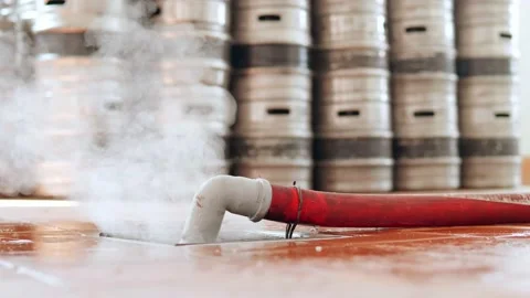 Bleeding gas from the pipe against the background of beer barrels Video stock 158264227