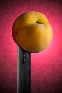 Bleeding Peach Stabbed with Katana Stock Photos