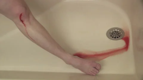 Bleeding twitching leg shower blood in drain Stock Footage 162579563