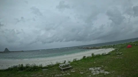 Bleik Beach and camping area with red tent under stormy dramatic sky in Norway Stock-Footage 343130556